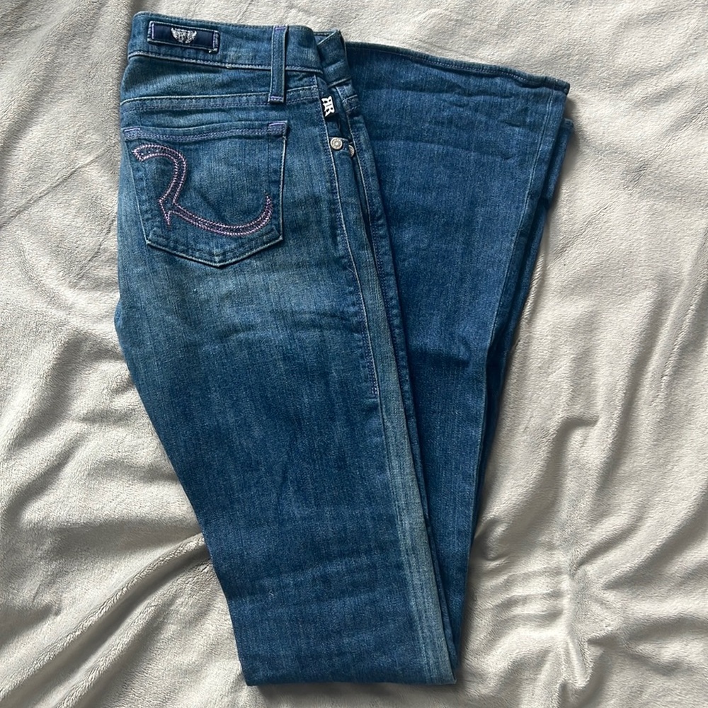 Rock & Republic medium wash flare jeans. Purple “R” pockets with rhinestones.